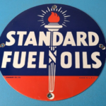 Vintage Standard Fuels Oils Sign – Porcelain Torch Graphic Gas Pump Plate Sign